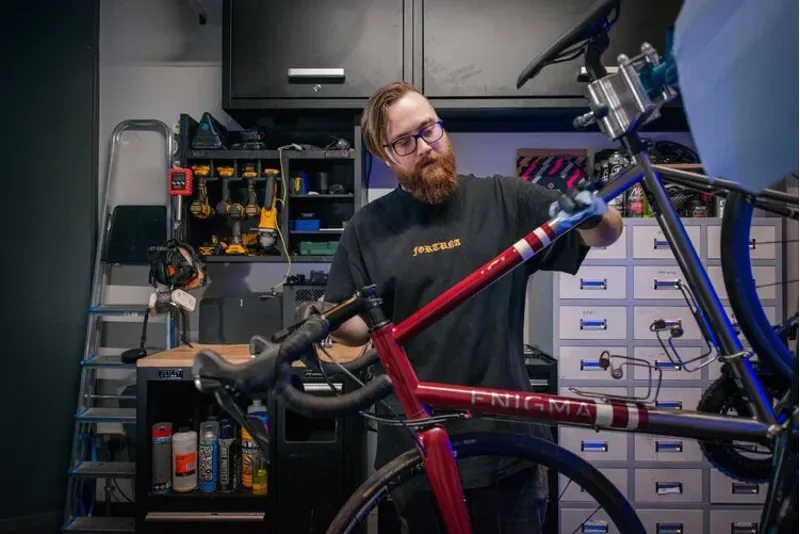 Mechanic working on a bicycle in a workshop