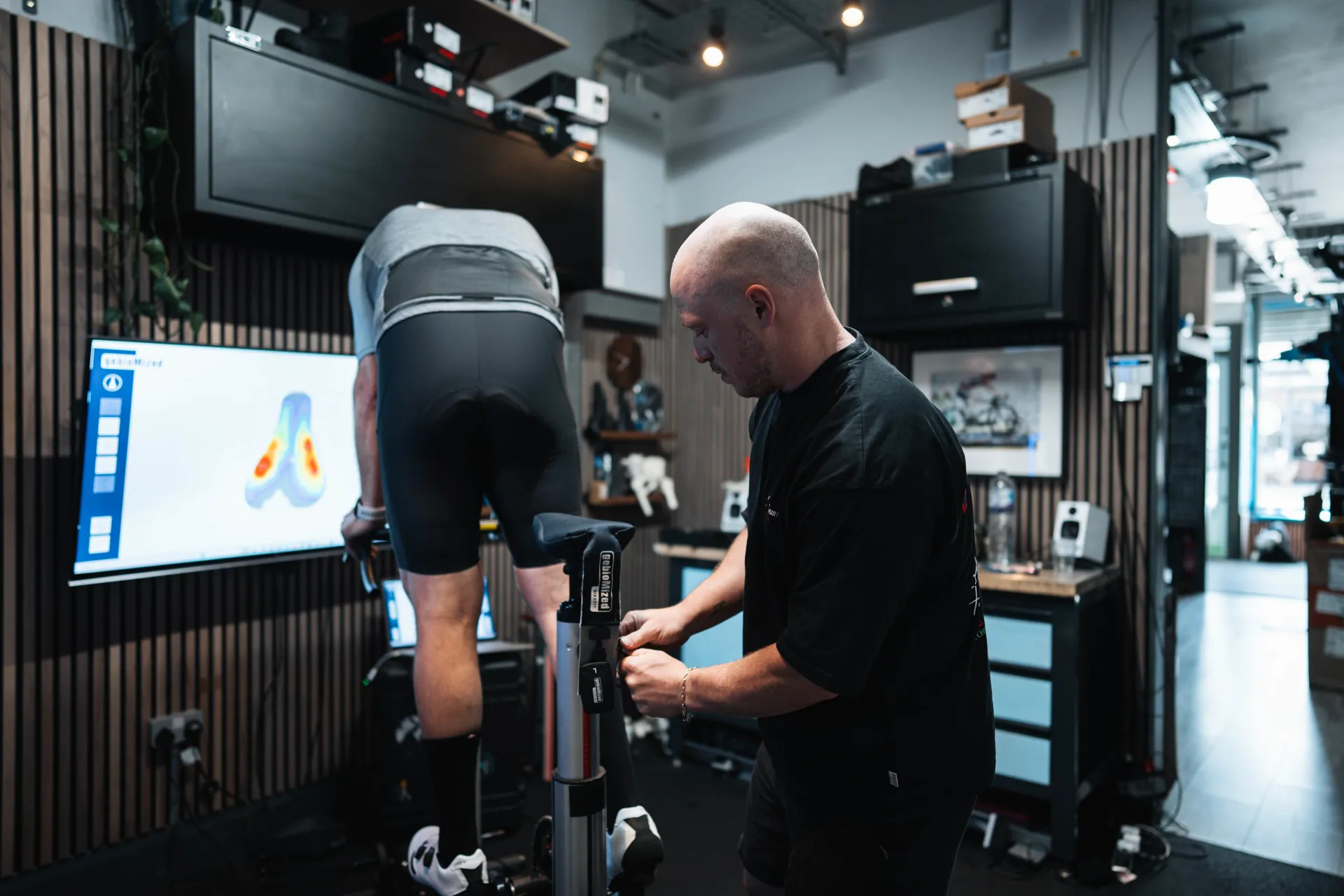 A cyclist being assessed off the bike