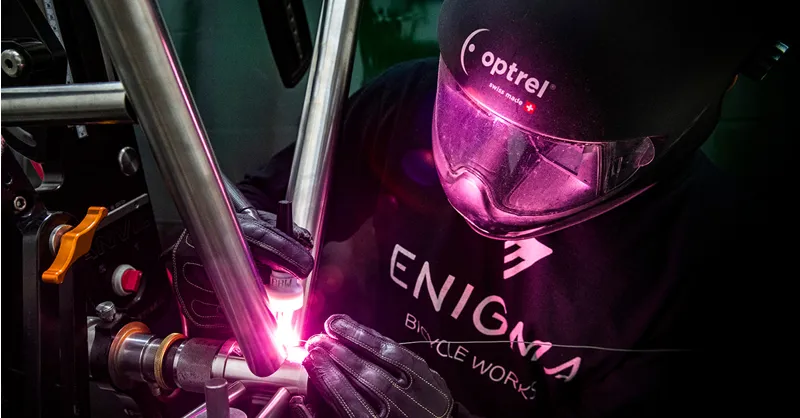 A titanium frame being welded by hand